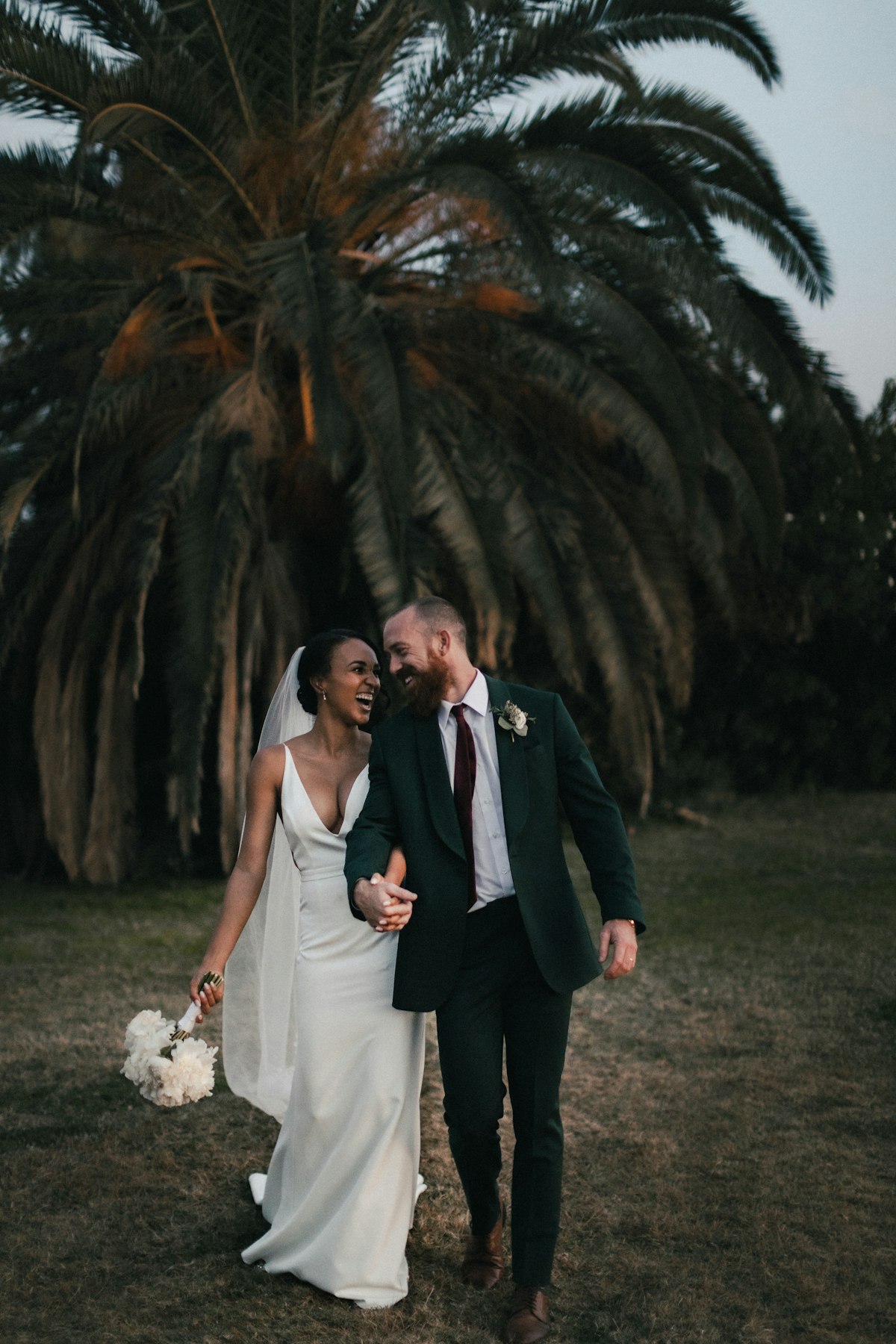 Bride and groom emotional embrace